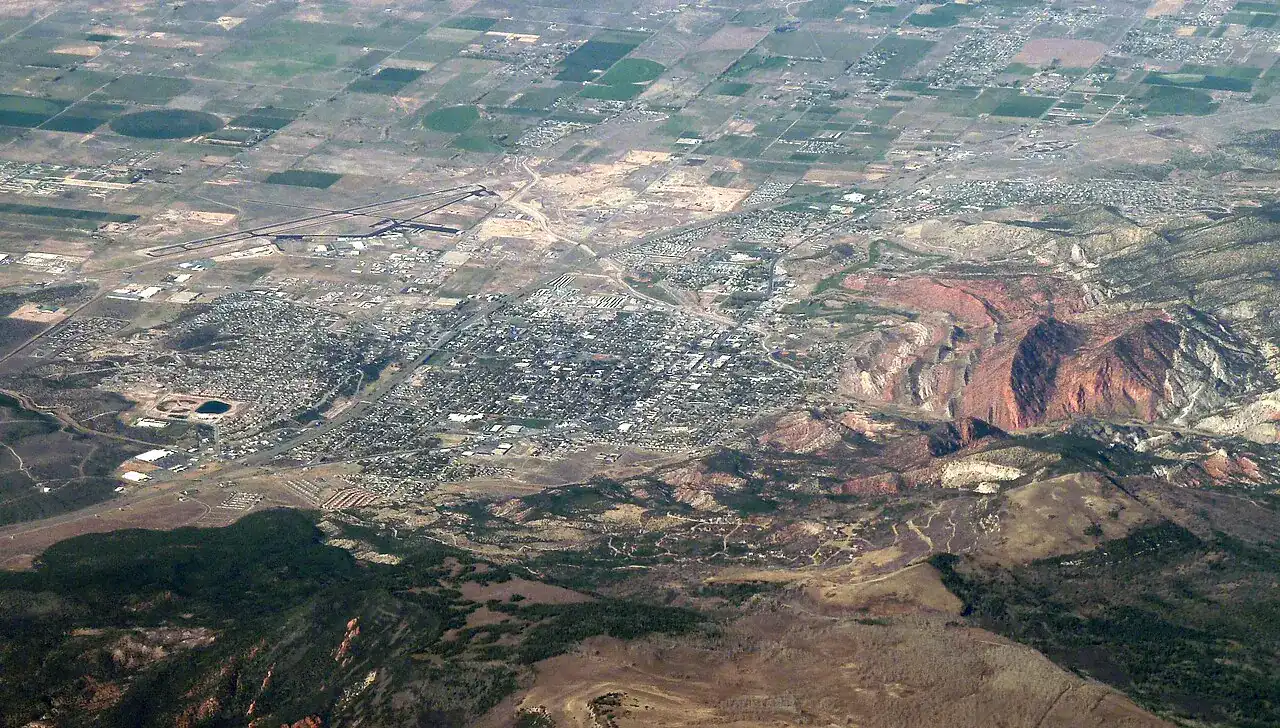 Aerial view across a southern Utah valley and red hills