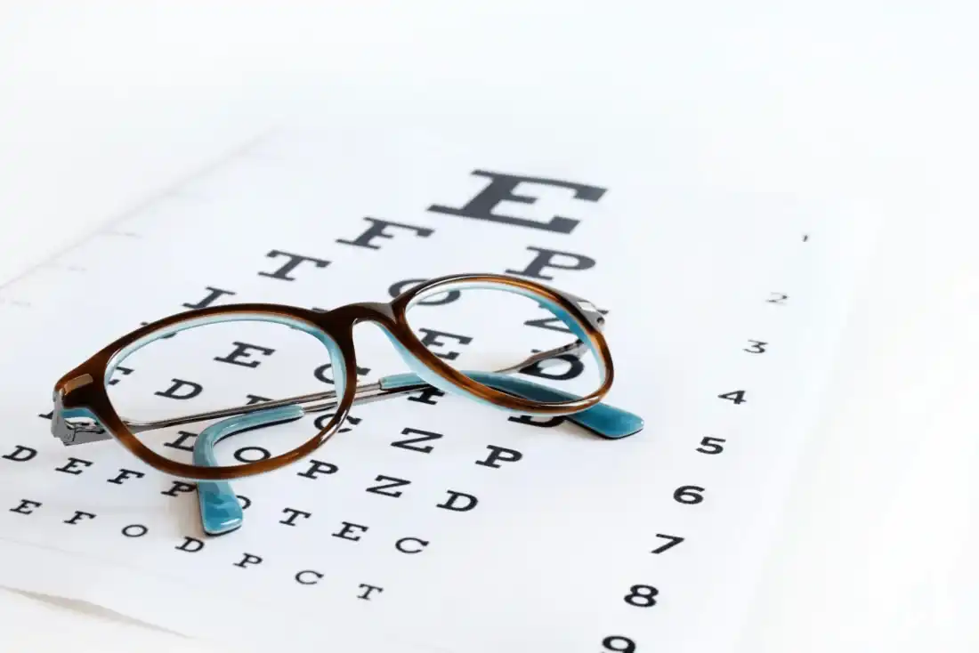 Glasses on an eye chart at Cedar Valley Eyecare