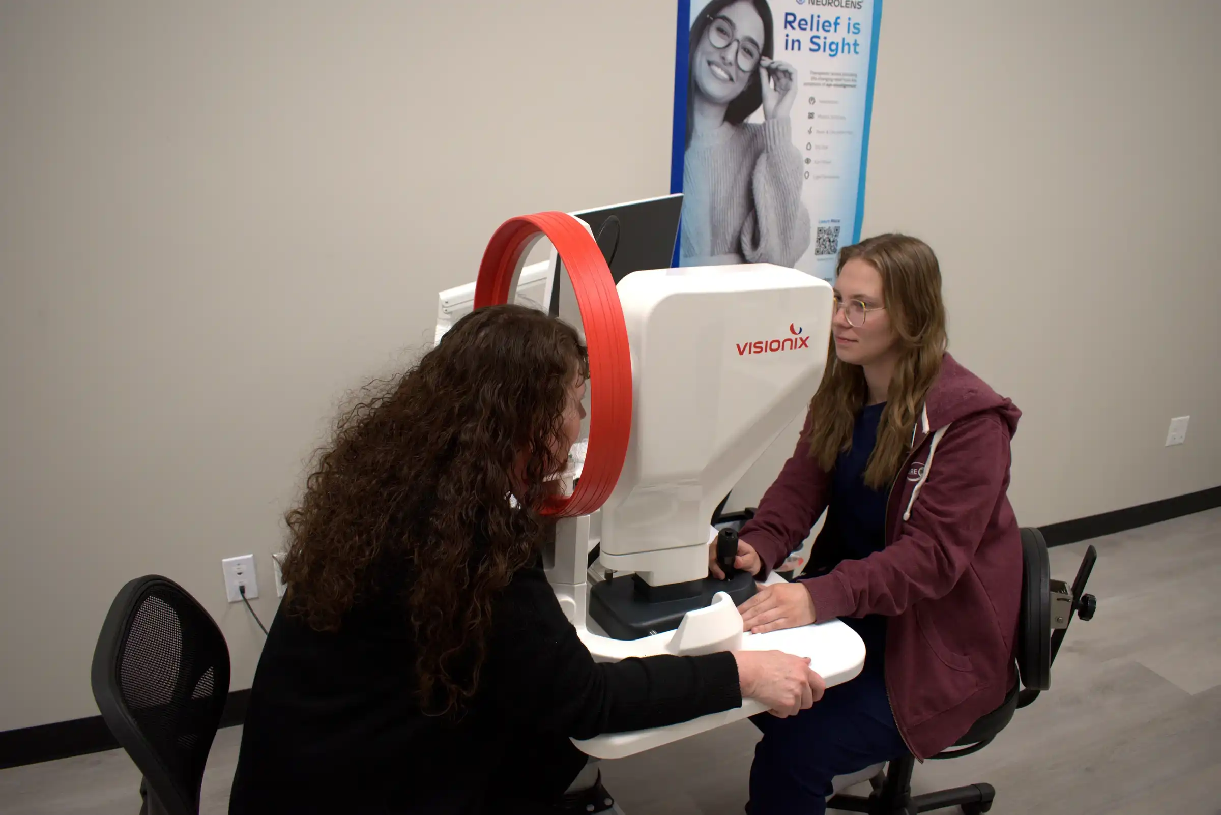 Patient using diagnostic technology at Cedar Valley Eyecare